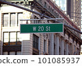 Green big West 20th Street sign hanging on a arch pole in the streets of midtown Manhattan 101085937