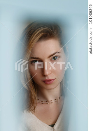 Woman portrait natural beautiful. Shoot with a blue blurred frame Woman portrait natural beautiful. Shoot with a blue blurred frame 101086246