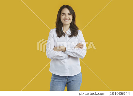 Portrait of joyful woman with satisfied expression on orange background in studio. Portrait of joyful woman with satisfied expression on orange background in studio. 101086944