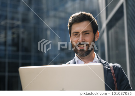 Stylish businessman with a laptop Stylish businessman with a laptop 101087085