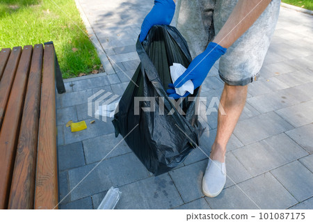 Garbage collection in the park. Environmental problems. Environmental protection concept. 101087175