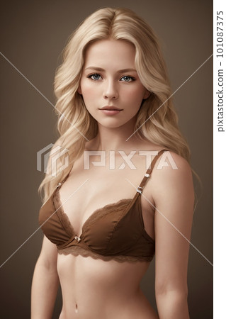 A woman in a brown bra Perfect female shapes posing on beige studio background 101087375