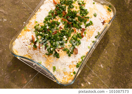tokan Hutsul cuisine. Corn porridge with cream, sheep cheese, cracklings and green onions tokan Hutsul cuisine. Corn porridge with cream, sheep cheese, cracklings and green onions 101087573