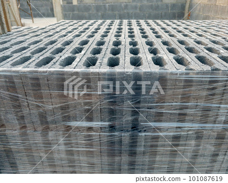 Closeup of the concrete block with the plastic wrap. Closeup of the concrete block with the plastic wrap. 101087619