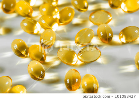 Capsules Omega 3 on white background. Copy space for your text. Fish fat, Health care concept Capsules Omega 3 on white background. Copy space for your text. Fish fat, Health care concept 101088427
