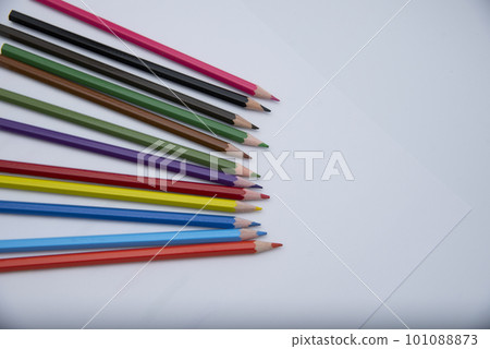 Colored pencils for drawing and coloring, on a white background. Figures made of colored pencils, school supplies Colored pencils for drawing and coloring, on a white background. Figures made of colored pencils, school supplies 101088873