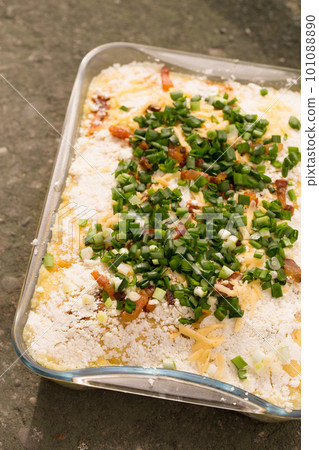 Banosh Hutsul cuisine. Corn porridge with cream, sheep cheese, cracklings and green onions Banosh Hutsul cuisine. Corn porridge with cream, sheep cheese, cracklings and green onions 101088890