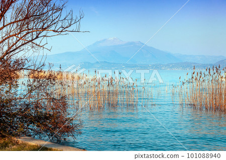 Early morning. Sunrise over the lake. Garda lake (Lago di Garda), Italy, Europe Early morning. Sunrise over the lake. Garda lake (Lago di Garda), Italy, Europe 101088940