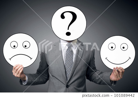 Conceptual image of a man changing his mood from bad to good Conceptual image of a man changing his mood from bad to good 101089442