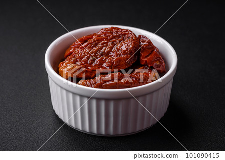 Delicious sun dried tomatoes in oil in a white ceramic bowl Delicious sun dried tomatoes in oil in a white ceramic bowl 101090415