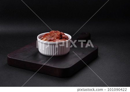 Delicious sun dried tomatoes in oil in a white ceramic bowl Delicious sun dried tomatoes in oil in a white ceramic bowl 101090422