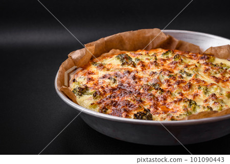 Delicious quiche with broccoli, cheese, chicken, spices and herbs 101090443