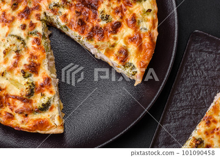 Delicious quiche with broccoli, cheese, chicken, spices and herbs Delicious quiche with broccoli, cheese, chicken, spices and herbs 101090458