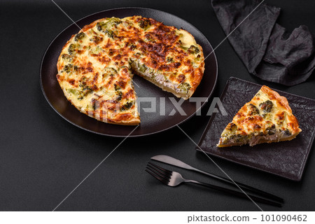 Delicious quiche with broccoli, cheese, chicken, spices and herbs 101090462