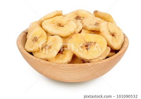 Dried banana chips in wooden bowl isolated on white background with full depth of field Dried banana chips in wooden bowl isolated on white background with full depth of field 101090532