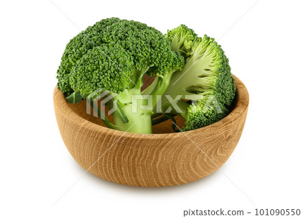 fresh broccoli in wooden bowl isolated on white background close-up with full depth of field. 101090550