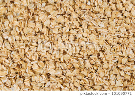 Background of oatmeal, closeup. View from above. Texture 101090771