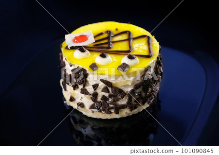 Serving dessert cake on a dark background, close-up. Sweet dessert Serving dessert cake on a dark background, close-up. Sweet dessert 101090845