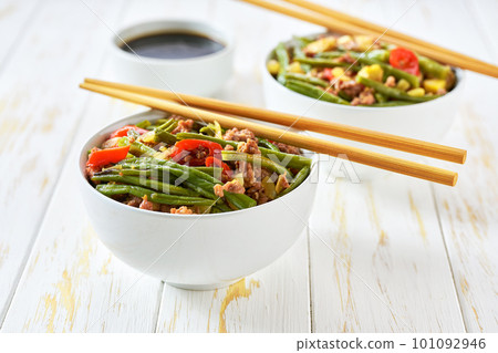pork dish with bean sprouts red pepper, garlic,ginger and soy sauce on white table. Chinese cuisine. 101092946