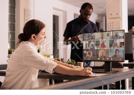 Employee chatting on teleconference, using videocall application. Office worker briefing, business report discussion on videoconference, remote team online collaboration at night Employee chatting on teleconference, using videocall application. Office worker briefing, business report discussion on videoconference, remote team online collaboration at night 101093769