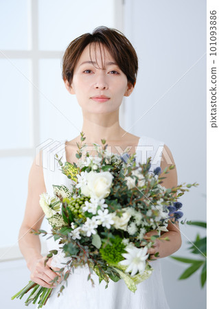 A woman holding a bouquet A woman holding a bouquet 101093886