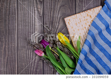 Passover is Jewish holiday celebrated by eating unleavened matzah bread during holiday 101094059