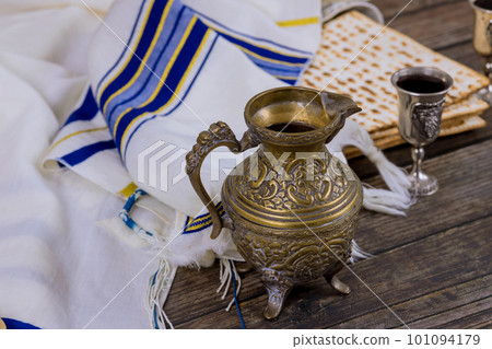 Passover is Jewish holiday celebrated with unleavened matzah bread and kiddush wine. 101094179