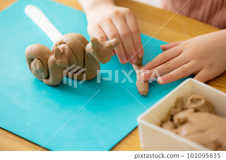 Children playing with clay 101095635