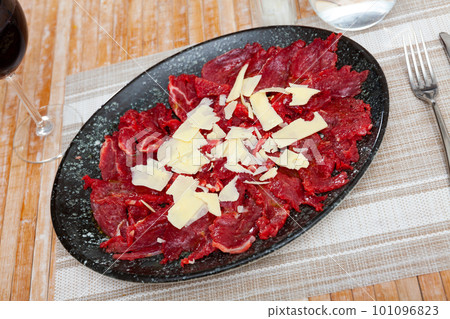 Carpaccio and cheese served on plate Carpaccio and cheese served on plate 101096823