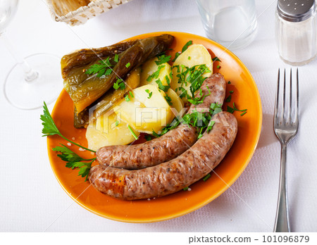 Grilled sausages with boiled potato and pepper Grilled sausages with boiled potato and pepper 101096879