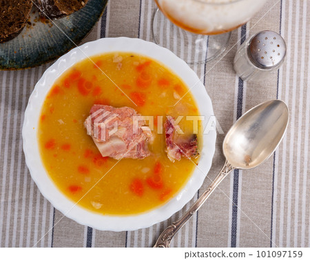 Hot pea soup with smoked meats and vegetables Hot pea soup with smoked meats and vegetables 101097159
