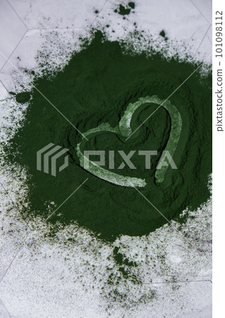 Heart on Blue-green algae Chlorella and spirulina powder. Super powder. Natural supplement of algae. Detox superfood drink cocktail. Food supplement source of protein and beta carotene 101098112