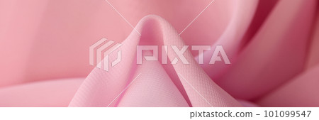 Cotton synthetic fabric in soft pink color closeup Cotton synthetic fabric in soft pink color closeup 101099547
