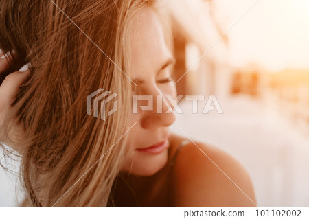 Happy woman portrait in cafe. Boho chic fashion style. Outdoor photo of young happy woman with long hair, sunny weather outdoors sitting in modern cafe. Happy woman portrait in cafe. Boho chic fashion style. Outdoor photo of young happy woman with long hair, sunny weather outdoors sitting in modern cafe. 101102002