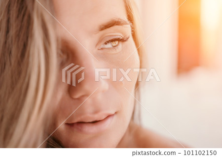 Happy woman portrait in cafe. Boho chic fashion style. Outdoor photo of young happy woman with long hair, sunny weather outdoors sitting in modern cafe. 101102150