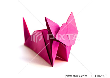 Pink paper cat origami isolated on a white background Pink paper cat origami isolated on a white background 101102908