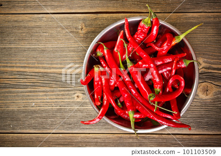 Red chili peppers in bowl Red chili peppers in bowl 101103509