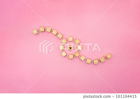 A pink background surrounded by a heart surrounded by strings of wood cubes floating from the left and right and gathered in a circle A pink background surrounded by a heart surrounded by strings of wood cubes floating from the left and right and gathered in a circle 101104415