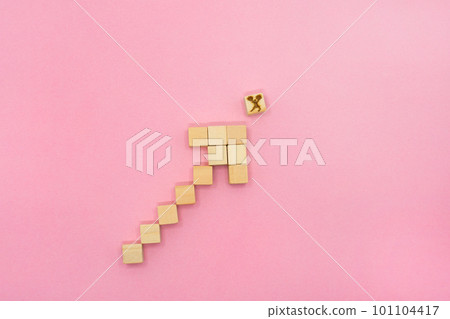 A pink background with a wood cube arrow rising to the right pointing to a woman sending an ale A pink background with a wood cube arrow rising to the right pointing to a woman sending an ale 101104417