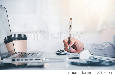 Doctor Day Concept. Nurse in uniform with doctor stethoscope writing information of patient prescription medical in paperwork checklist on clipboard on front laptop computer, medication history record Doctor Day Concept. Nurse in uniform with doctor stethoscope writing information of patient prescription medical in paperwork checklist on clipboard on front laptop computer, medication history record 101104433