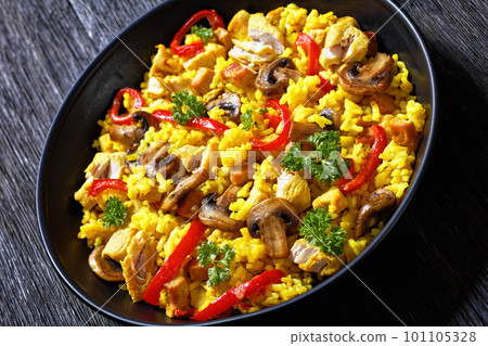 Chicken Paella with mushrooms, red pepper, spices Chicken Paella with mushrooms, red pepper, spices 101105328