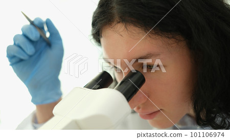 Scientist chemist looking into microscope in chemical laboratory Scientist chemist looking into microscope in chemical laboratory 101106974