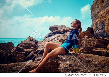 Young woman takes sun baths Young woman takes sun baths 101107937