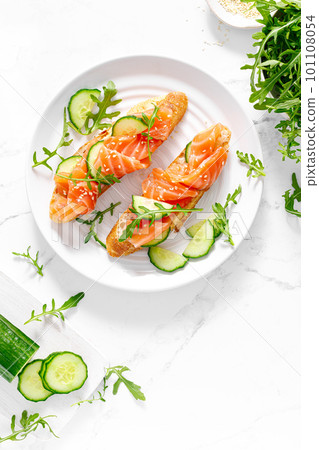 Sandwiches with salted salmon. Healthy food, breakfast. Top view 101108054