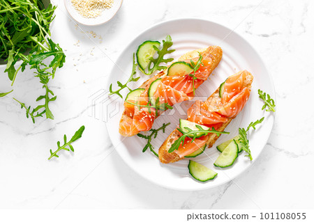 Sandwiches with salted salmon. Healthy food, breakfast. Top view 101108055