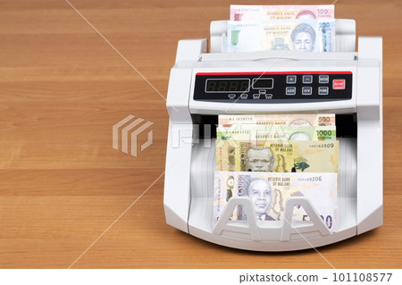 Malawian money - new series of banknotes in the counting machine 101108577