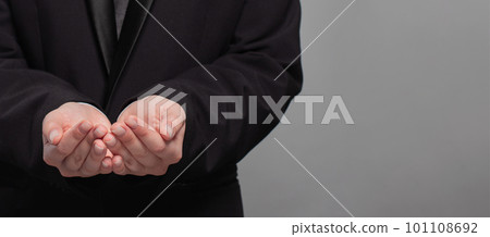 Businessman hands on grey background. Communication, technology,  IoT, internet, global, network, futuristic concept 101108692