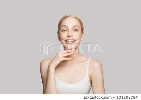 Gorgeous woman touching her chin and laughing 101108784