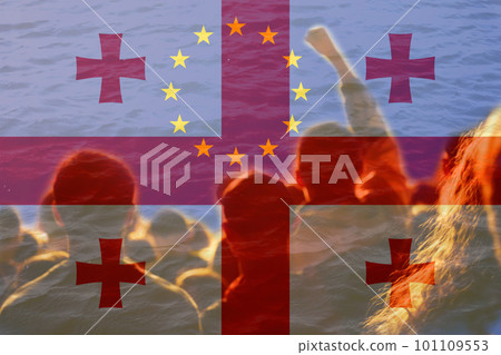 European Union flag Georgia. Conflict war over border. Fire, flame. Georgia flag. Woman low rights. Male hands. Authoritarian law. Foreign agents. Fire and flame. Police. Out of focus 101109553