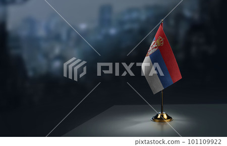 Small flags of the Serbia on an abstract blurry background Small flags of the Serbia on an abstract blurry background 101109922